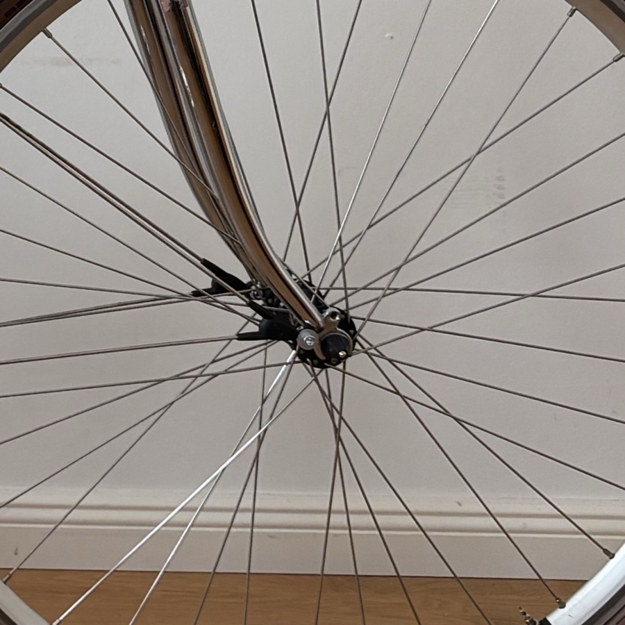 Video still — hub rebuild, hands + tools